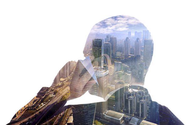 Double exposure of businessman and cityscape. Business & technology concept.